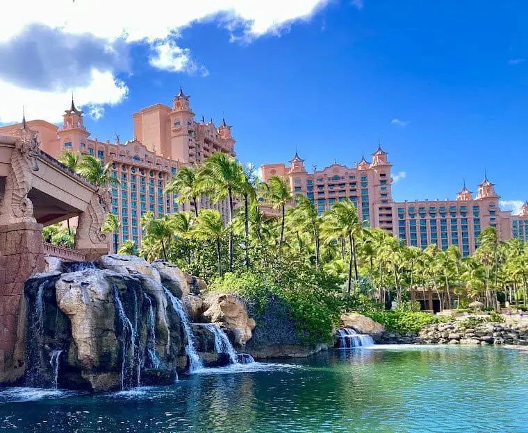 Atlantis hotel in Nassau Bahamas. View of building with waterfall and pond in front.