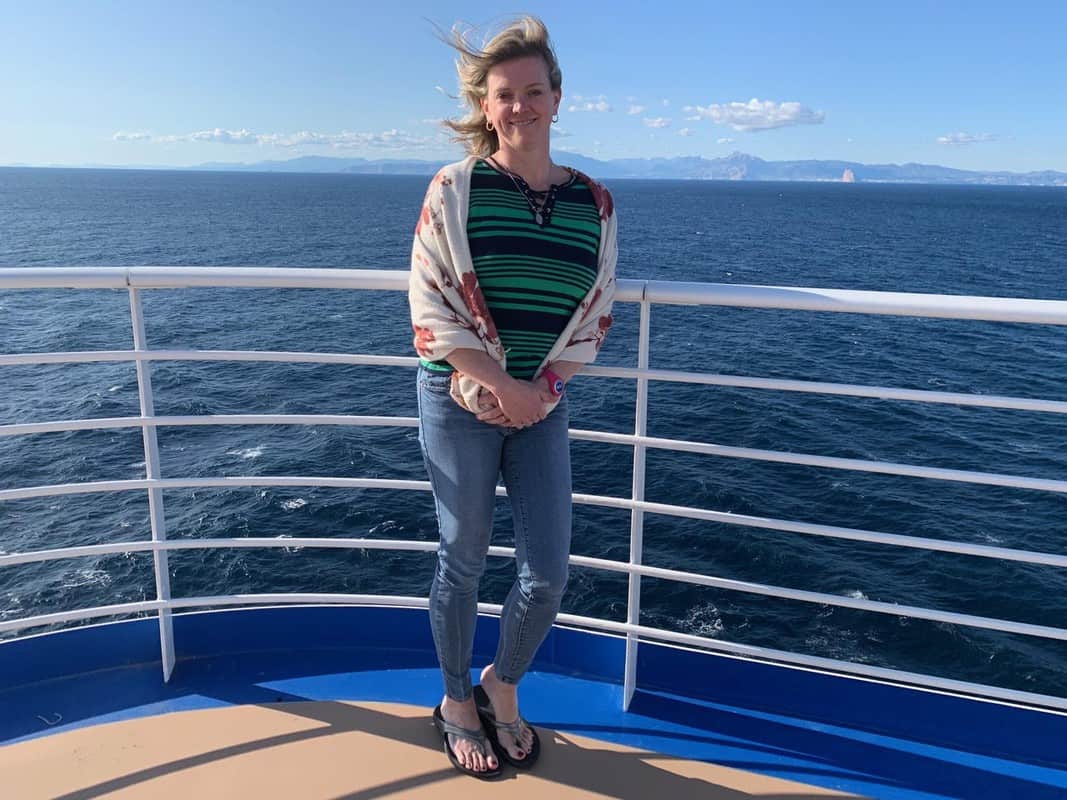 Lyn wearing Oofos on cruise ship