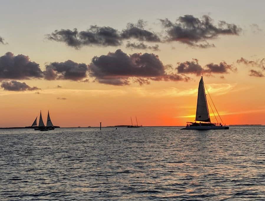 Two sailboats in the Florida Keys at sunset.