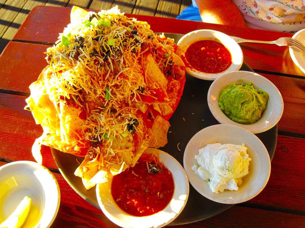 Nachos surrounded by salsa, sour cream and guacamole at Signal Mountain Trapper Grill