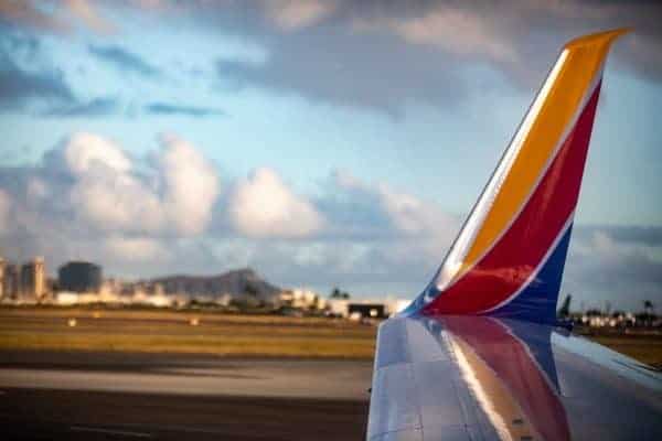 The Southwest airplane wing on the tarmac.