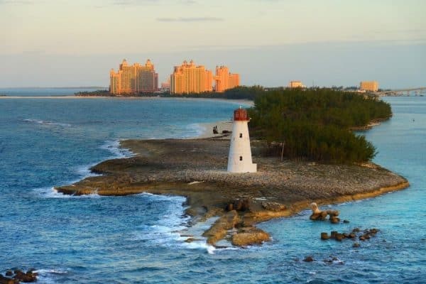 A lighthouse stands on an island in the midst of the ocean, offering a picturesque attraction among the things to do in Nassau.
