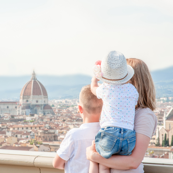 A woman and a child looking at the city of florence.