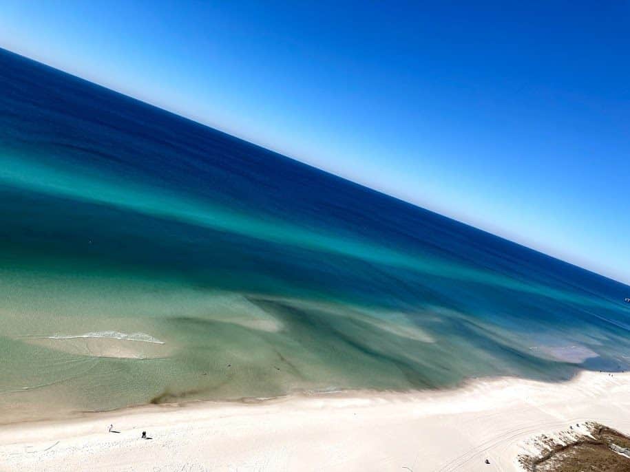 An aerial view of a beach and ocean.